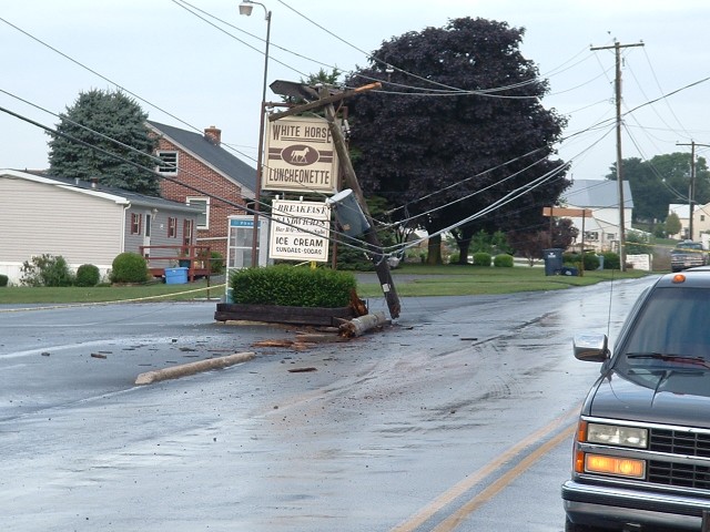 Vehicle accident with pole down in front of the White Horse Luncheonette...8/4/03